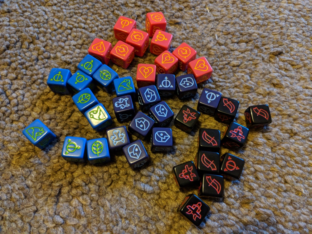 The 4 types of dice found in the Ashes base set
